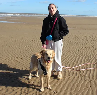 Picture of Toni with Buffy on the beach